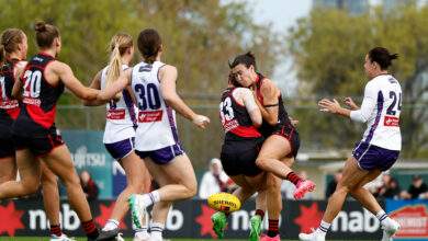 Essendon teammates Amber Clarke and Bonnie Toogood collide.