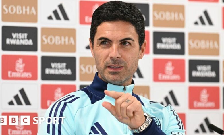 Mikel Arteta gestures towards a reporter