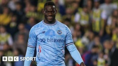 Mario Balotelli smiling during the Turkish Super League match between his side Adana Demirspor and Fenerbahce.