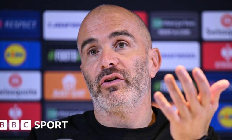 Chelsea manager Enzo Maresca gestures with his hand during a news conference