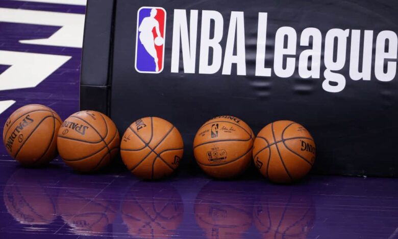 NBA basketballs on the court before the NBA game between the Phoenix Suns and the Dallas Mavericks at PHX Arena on December 23, 2020 in Phoenix, Arizona. The Suns defeated the Mavericks 106-102.