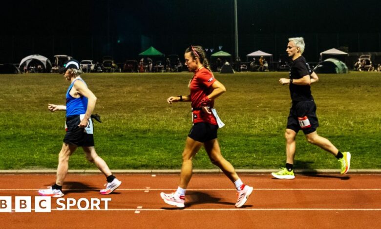 Competitors run through the night in the Sri Chinmoy 24hr Track Race in Battersea Park