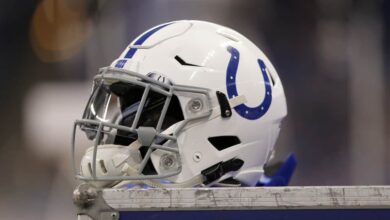 A Indianapolis Colts helmet sits on top of a equipment locker during the NFL game between the Miami Dolphins and Indianapolis Colts on November 25, 2018, at Lucas Oil Stadium in Indianapolis, IN.